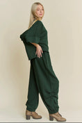 Load image into Gallery viewer, Forrest green two piece sweatshirt and sweatpants by Davi and Dani. Barrel style pants. 
