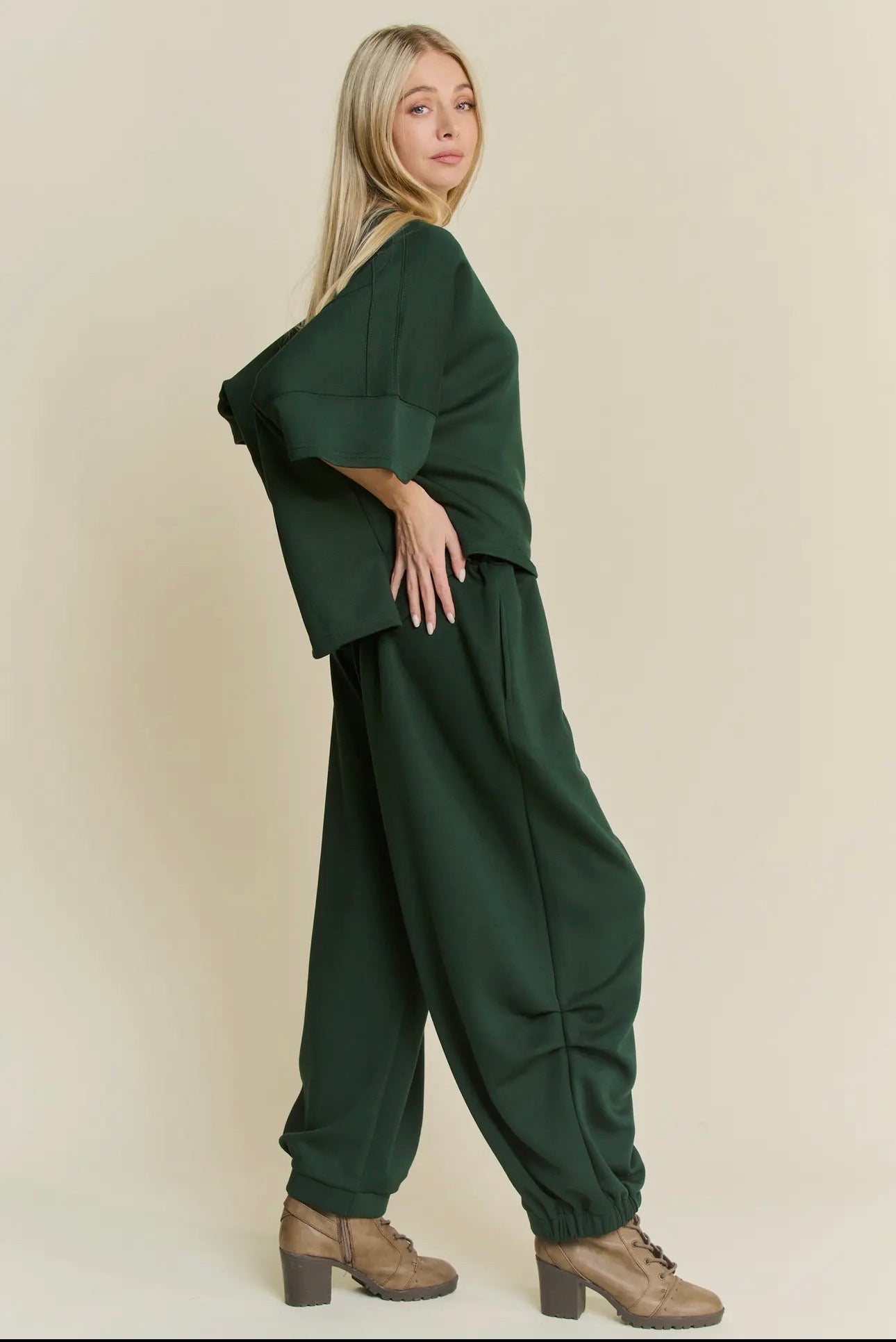 Forrest green two piece sweatshirt and sweatpants by Davi and Dani. Barrel style pants. 
