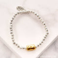 Load image into Gallery viewer, Bago Lava Nugget Bracelet with Hammered Barrel Bead Accent
